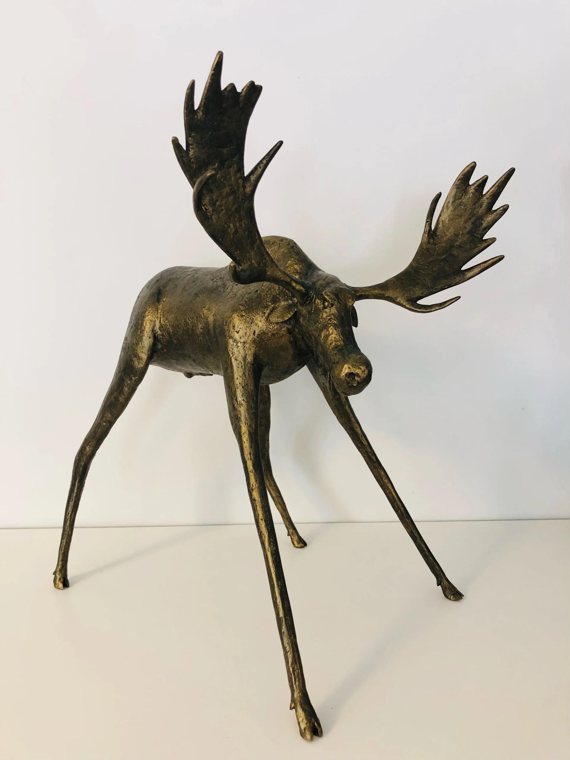 Photograph of a bronze moose sculpture created by Mark Hinan